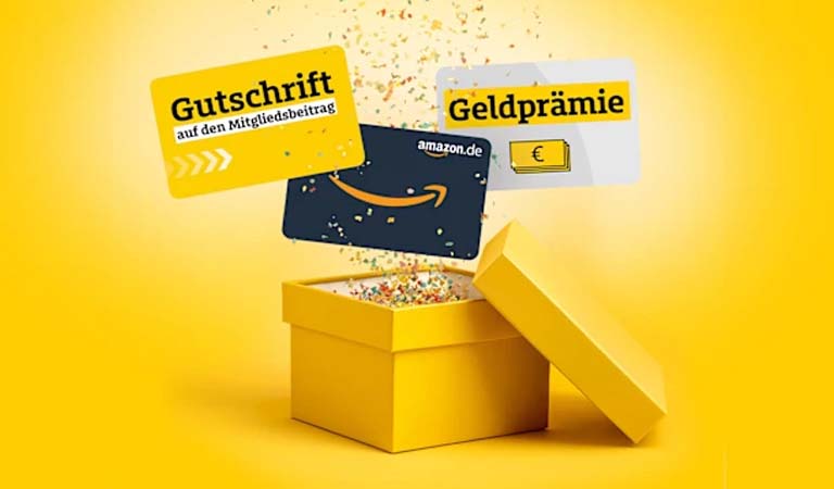 Eine gelbe Geschenkbox mit buntem Konfetti und drei verschiedenen Gutscheinkarten
